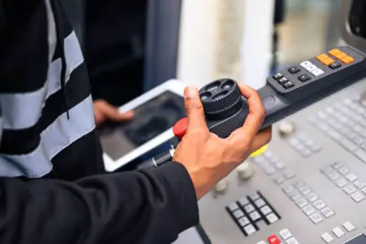 Engineer Mechanician Operating And Controlling Cnc Machine