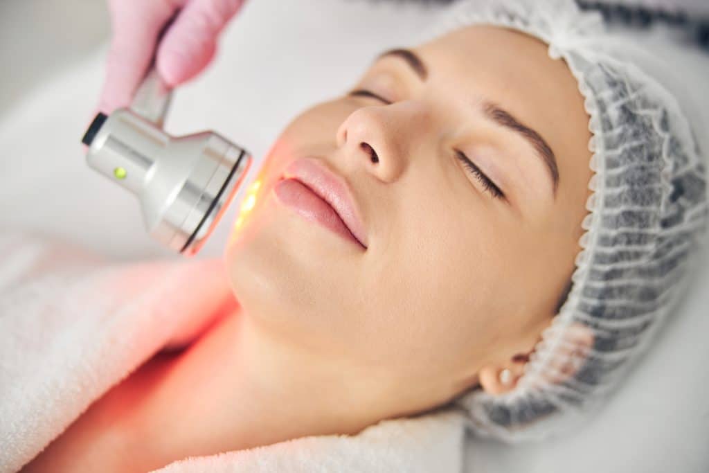 Young Woman At A Light Therapy Session