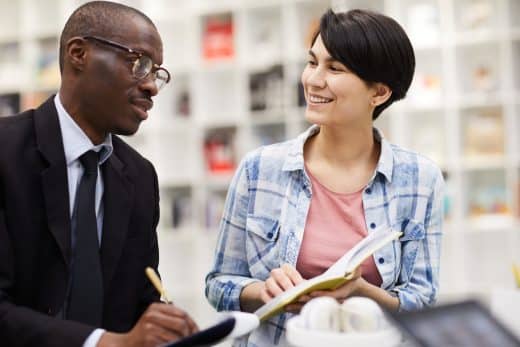 Cheerful Girl Presenting Project To Investor