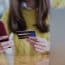 Young Woman Paying Online By Smartphone And Credit Card, Online