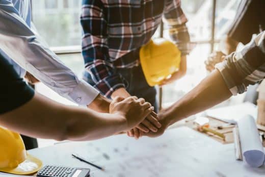 Construction Worker And Contractor. Client Shaking Hands With Te