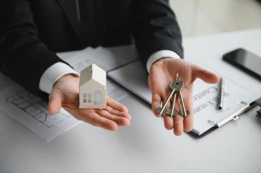 Real Estate Company To Buy Houses And Land Are Delivering Keys And Houses To Customers After Agreeing To Make A Home Purchase Agreement And Make A Loan Agreement. Discussion With A Real Estate Agent