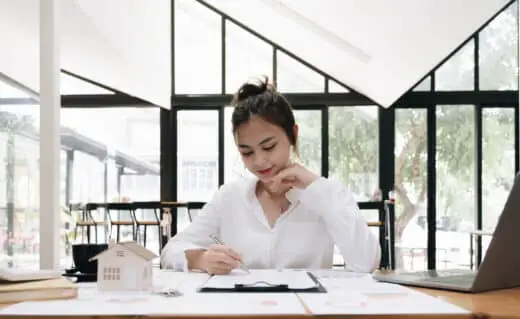 Real Estate Agent And Customer Signing Contract To Buy House, Insurance Or Loan Real Estate. Rent A House, Get Insurance, Or Mortgage Loan Real Estate Or Property.