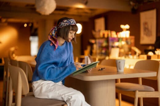 Woman Works On Touchpad At Coffee Shop 2023 11 27 05 11 13 Utc