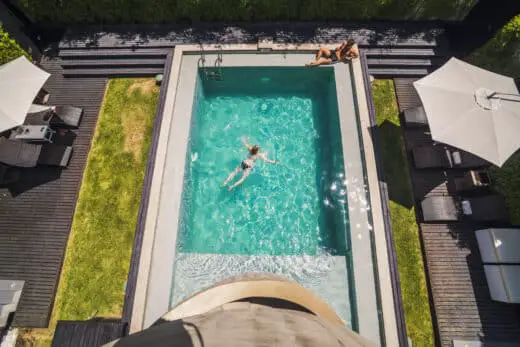Couple At A Swimming Pool On Vacation At Luxury Hotel Accommodation, Santiago, Chile, South America