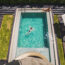 Couple At A Swimming Pool On Vacation At Luxury Hotel Accommodation, Santiago, Chile, South America