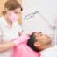 Professional Trichologist Treating Young Man For Hair Loss