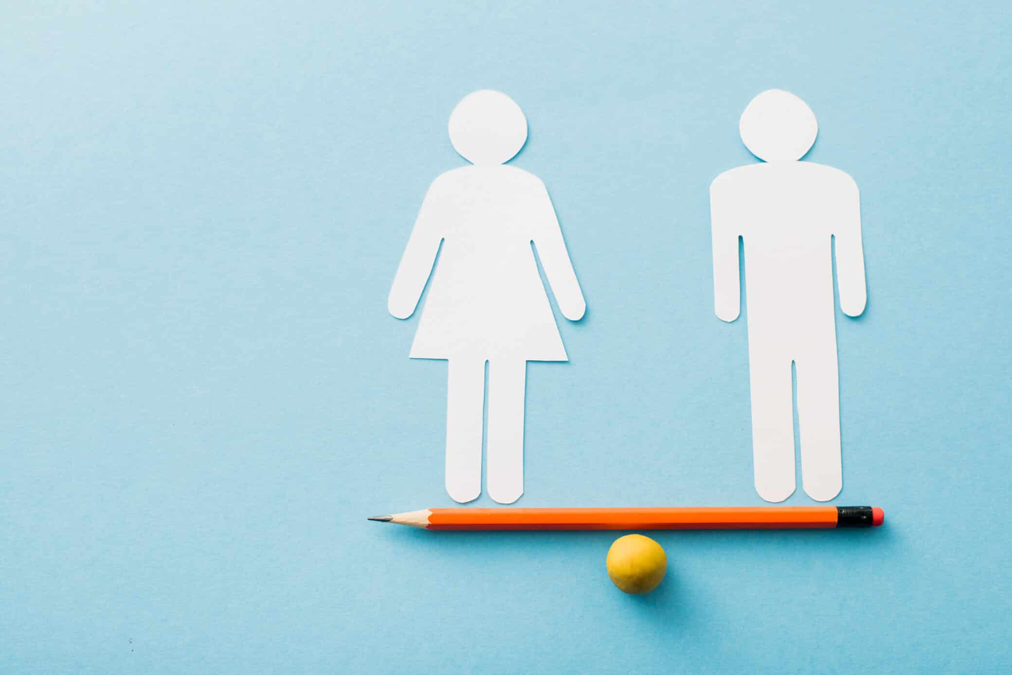 Small Ball And Pencil With Paper Cut Of Couple Isolated On Blue, Sexual Equality Concept