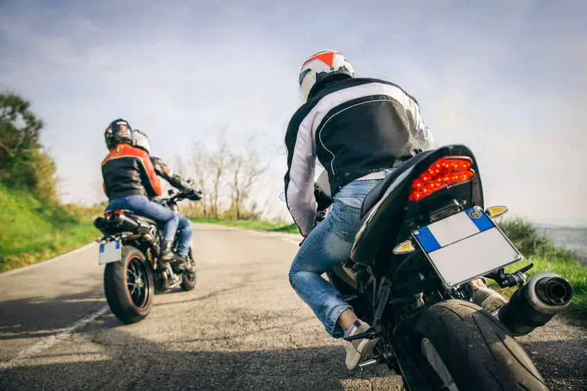 Two Motorbikes Driving In The Nature