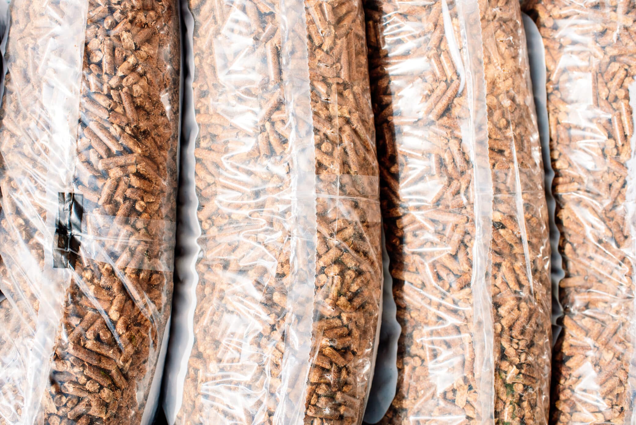 Wood Pellets In Transparent Bags As Sustainable Fuel For Heating